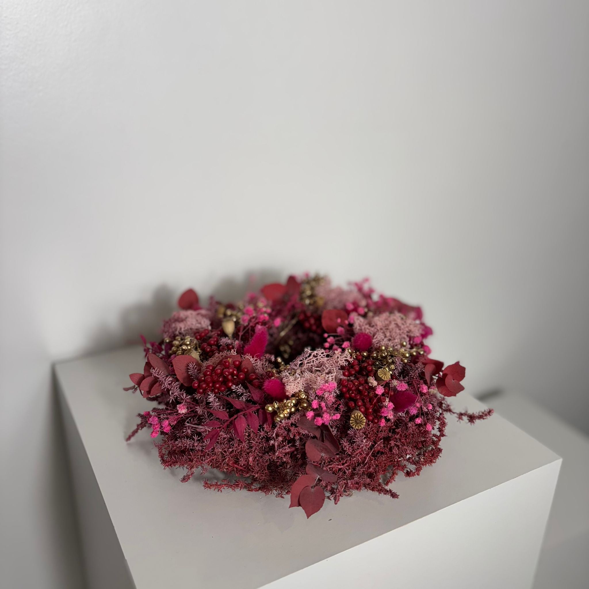 Advent wreath red made of dried flowers - pink