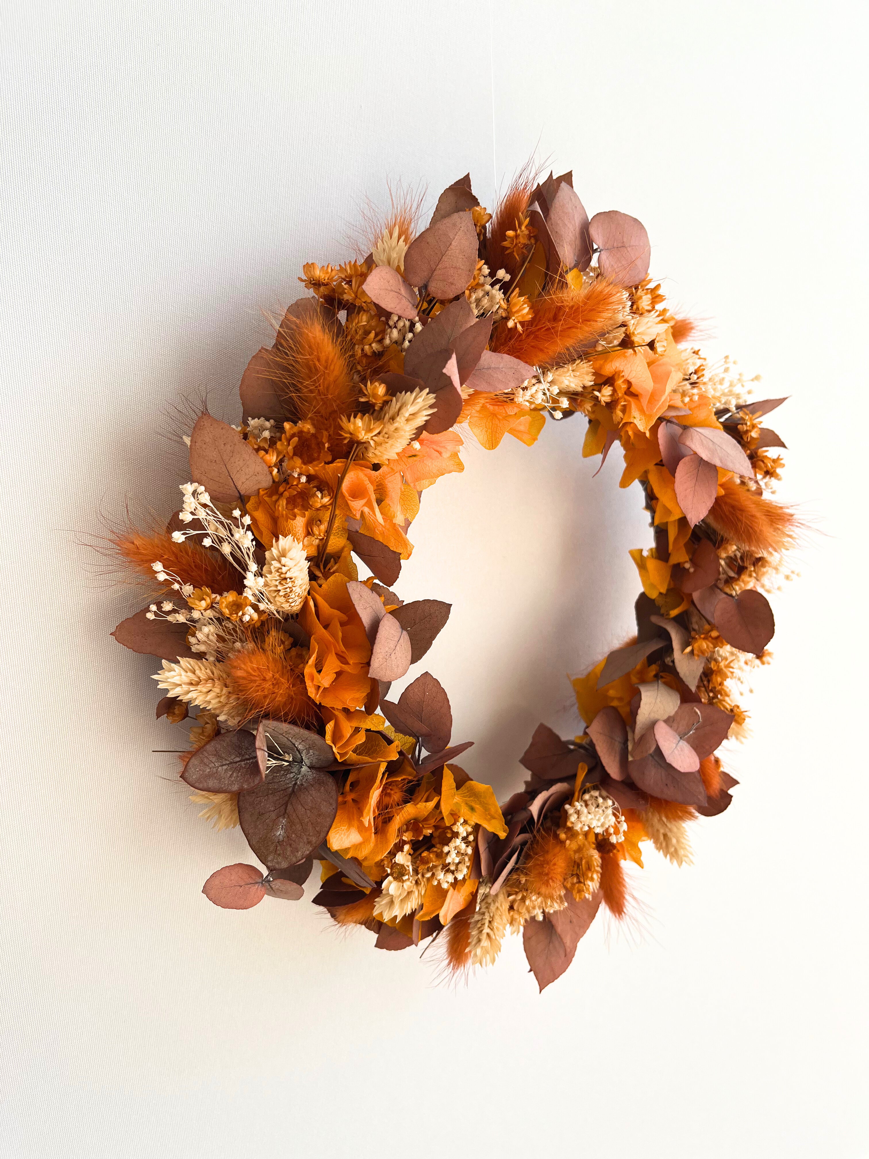 dried flower wreath in autumnal orange