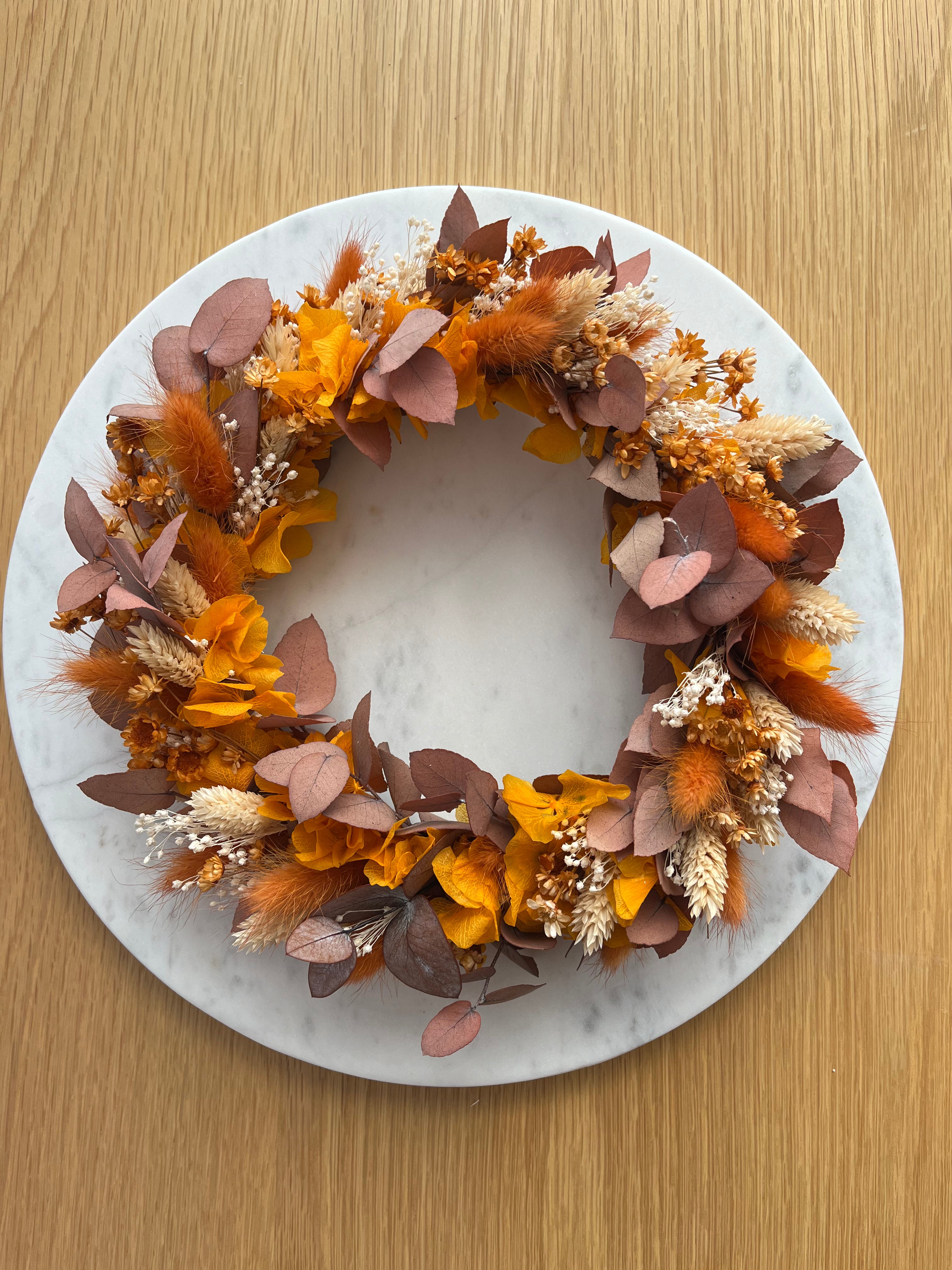 dried flower wreath in autumnal orange