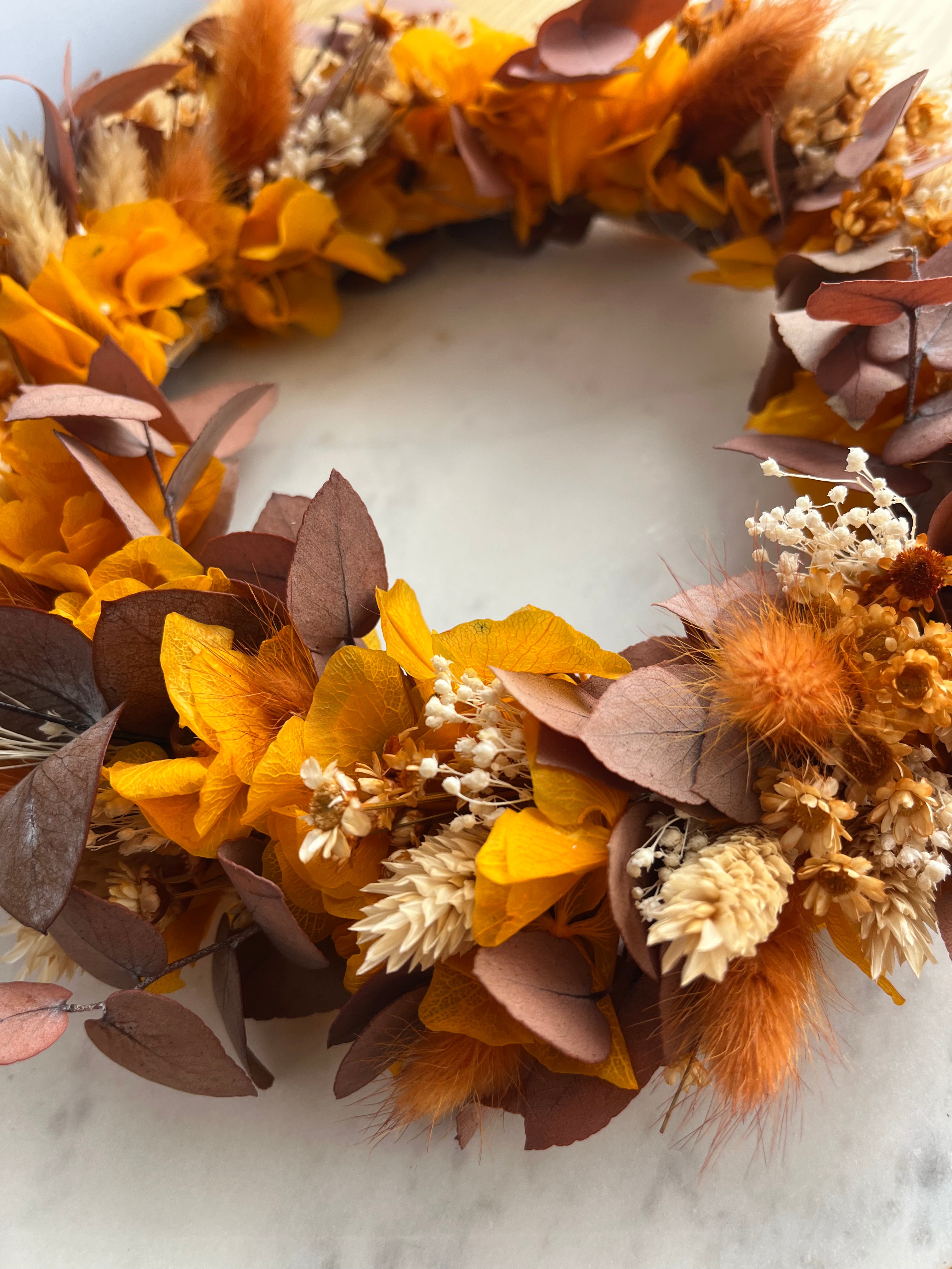 dried flower wreath in autumnal orange