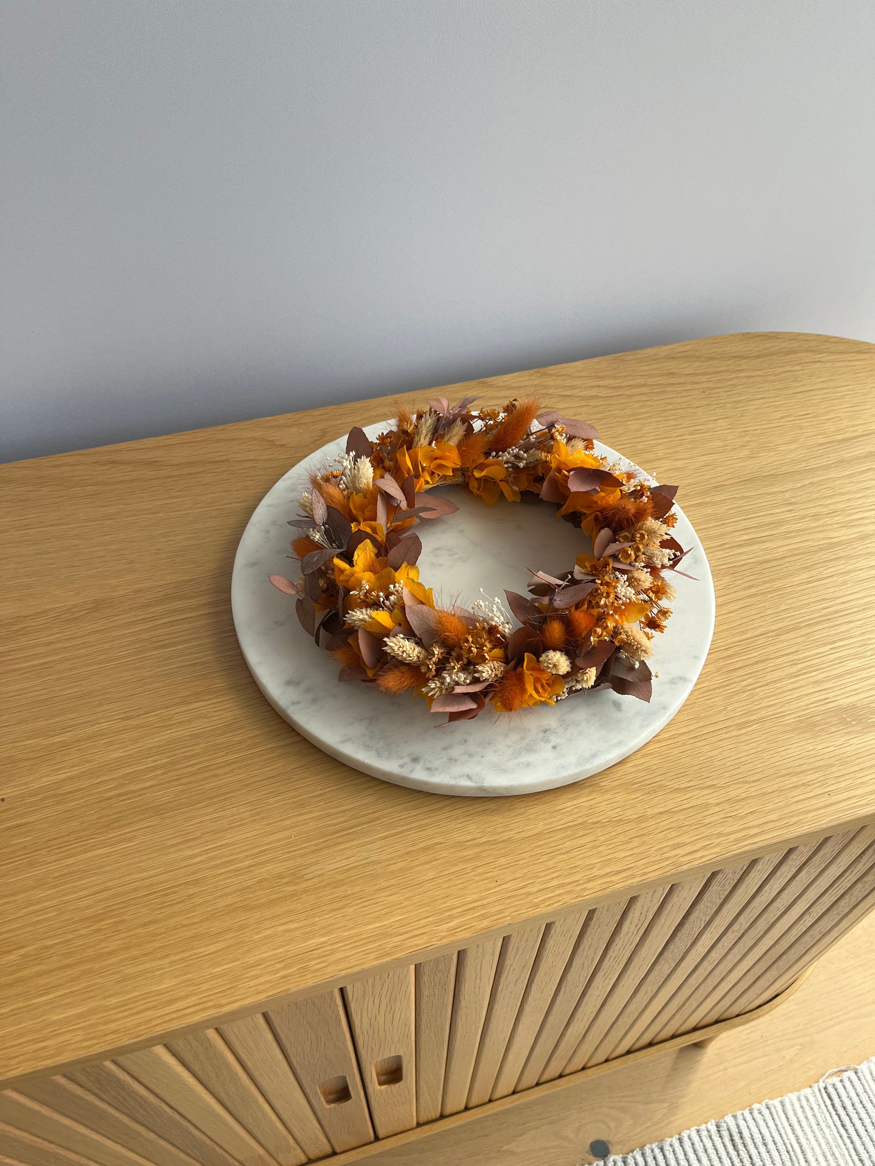 dried flower wreath in autumnal orange