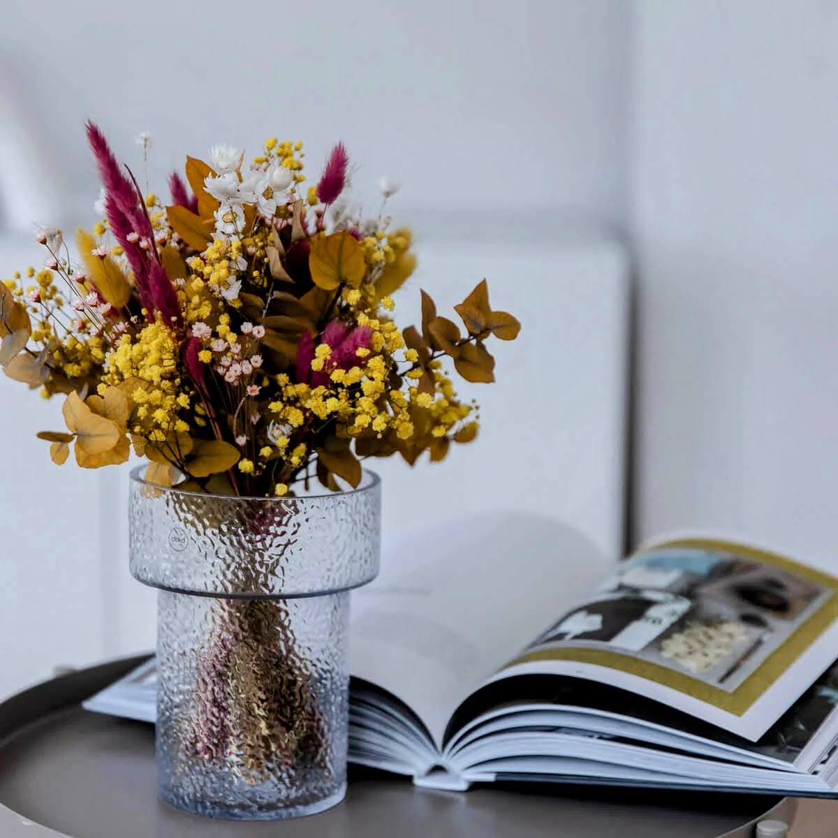 Lively: Yellow eucalyptus and magenta in a dried flower arrangement