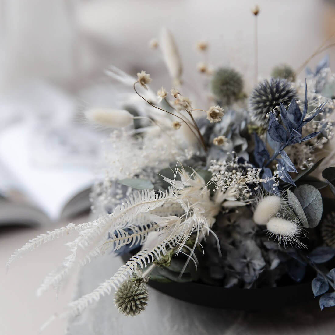 Elegance in blue and white: dried flower arrangement with eucalyptus